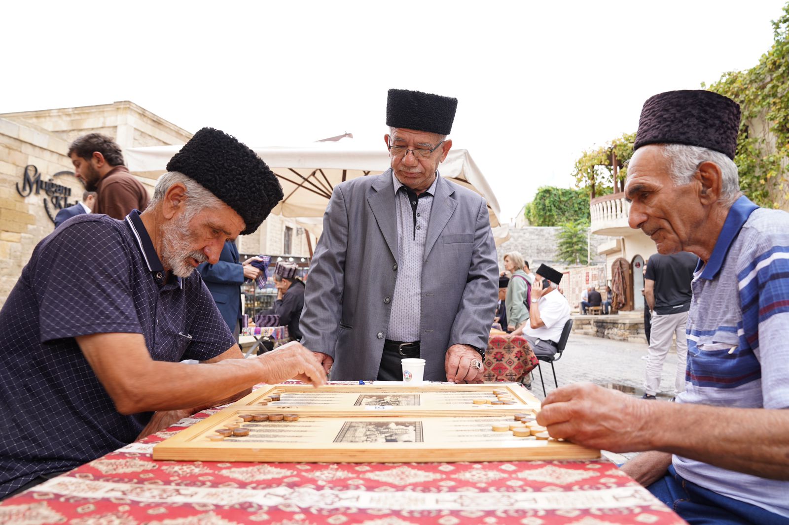 “Backgammon Tournament Among Elders”